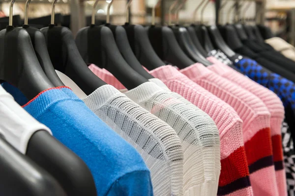 Womens sweaters on hanger in the store — Stock Photo, Image