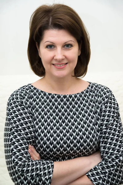 Portrait of a woman in gray dress — Stock Photo, Image