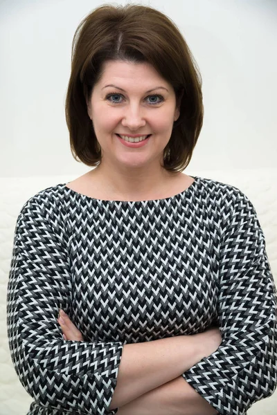 Portrait of a woman in gray dress — Stock Photo, Image