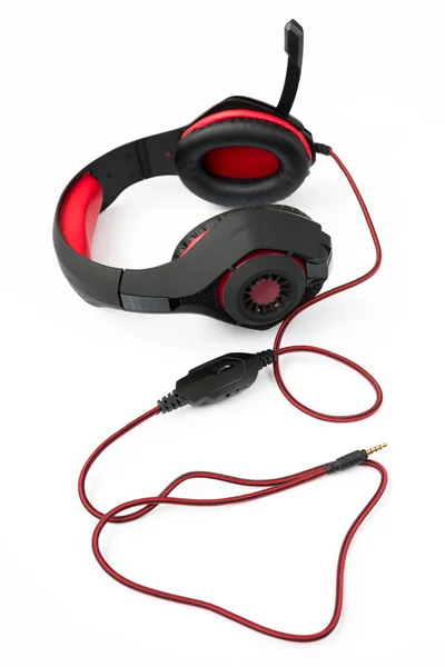 Black gaming headphones with cord on white background — Stock Photo, Image