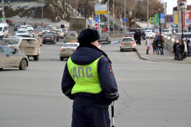 Kazan, Russia - Mar 27.2017.traffic police inspector is on duty in city street. clipart