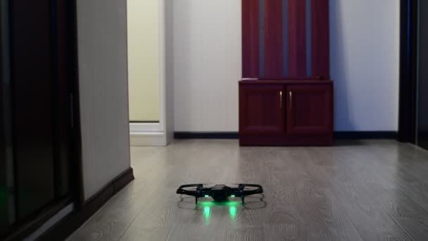 The quadrocopter soars up in room — Stock Video