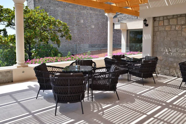 A Wicker chairs and table on the outdoor terrace — Stock Photo, Image