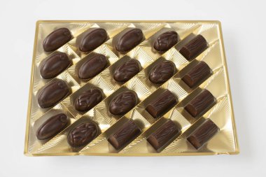 dark chocolate candies packaged on a light background