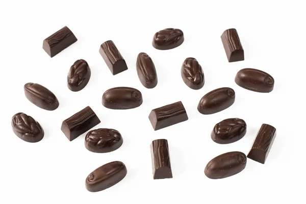 Dark chocolate candies on a light background — Stok fotoğraf