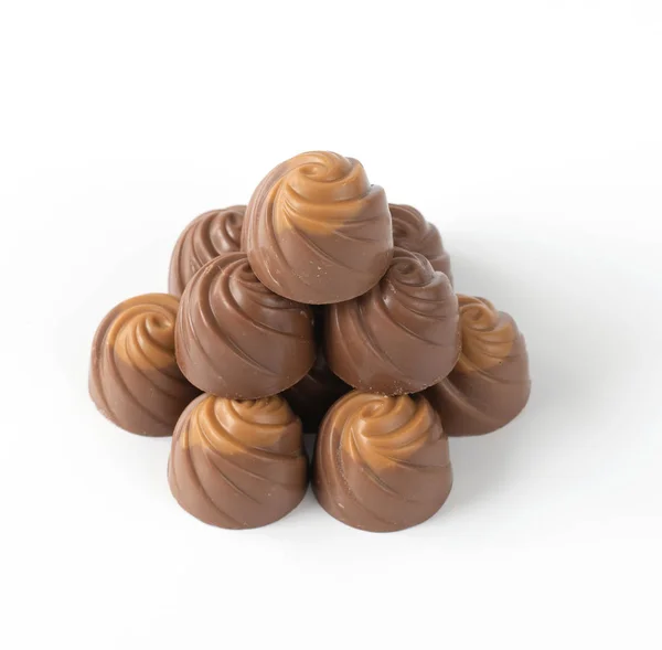 Milk chocolate candies on a light background — Stock Photo, Image