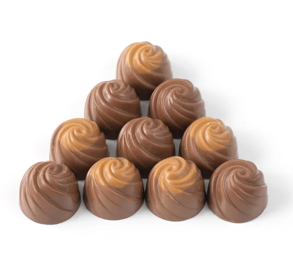 Milk chocolate candies on a light background — ストック写真