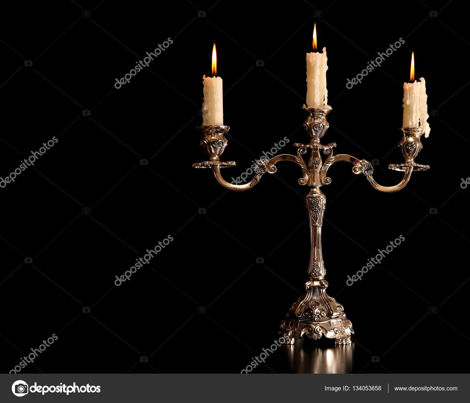 Burning Old Candle Vintage Silver Bronze Candlestick Isolated Black Burning Old Candle Vintage Bronze Candlestick Isolated On Black Background Photo By Natalyaa