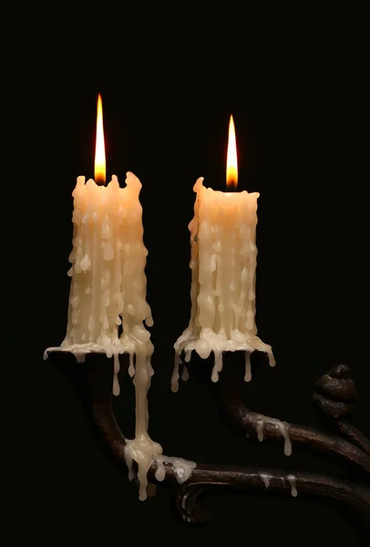 Burning old candle vintage Silver bronze candlestick. Isolated Black Background. — Stock Photo, Image