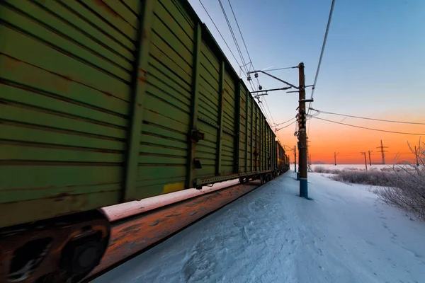 Winter railway and train with cargo. — Stock Photo, Image
