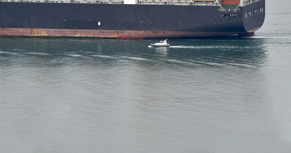 Pilot boay appraching a big vessel — Stock Photo, Image