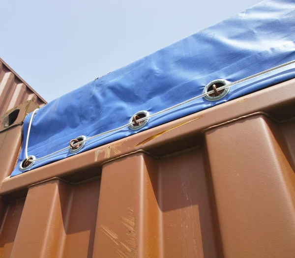 detail of open top container in a ship