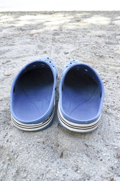 plastic shoes on the beach