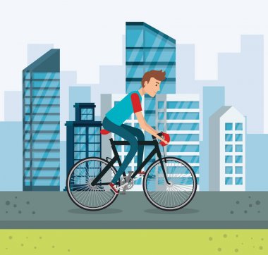 Parktaki bisikletli genç adam.