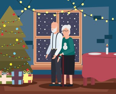 Büyük anne ve büyük baba, oturma odasında Noel süslemeleri ile birlikte.