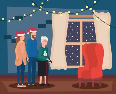 Noel şapkası takan genç bir çift olan sevimli büyükanne.