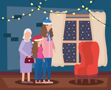 Kızı ve torunu olan büyükannesi Noel süslemesi yaptırmış.