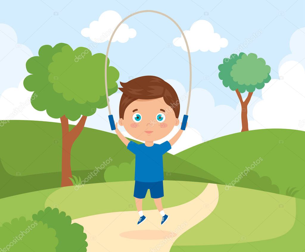 cute boy in park with jumping rope