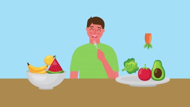Hombre joven con comida fresca y saludable en un tazón — Vídeo de stock