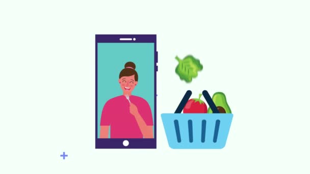 Woman with healthy food in basket and smartphone — Stock Video