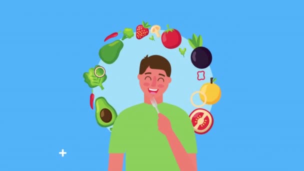 Young man with fresh healthy food — Stock Video