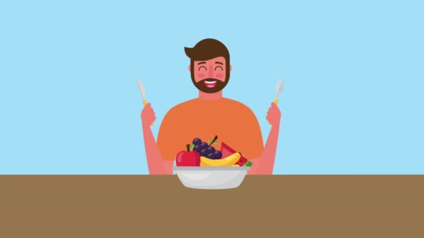 Fiatal férfi friss egészséges élelmiszer tálban — Stock videók