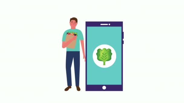 Young man with fresh healthy food in smartphone — 비디오