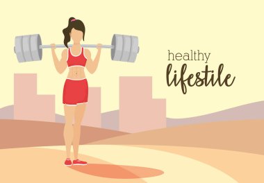 Park karakterinde ağırlık kaldıran genç bayan sporcu.