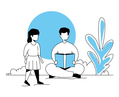 Babası ve kızı park manzarasında kitap okuyorlar.