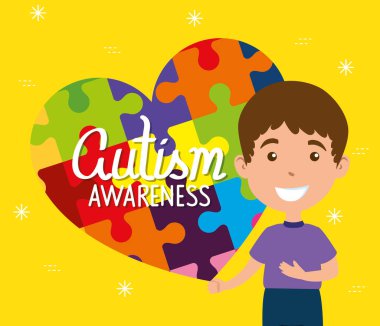 Dünya otizm günü ve yapboz parçaları olan çocuk