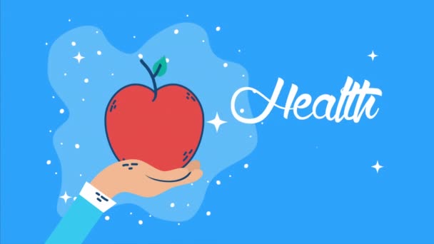 Internationell hälsodag med handlyft av äpple och bokstäver — Stockvideo