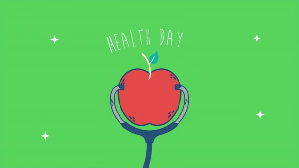 Międzynarodowy dzień zdrowia z jabłkiem i stetoskopem — Wideo stockowe