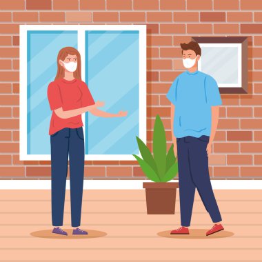 Evin içinde maske takan genç bir çift.