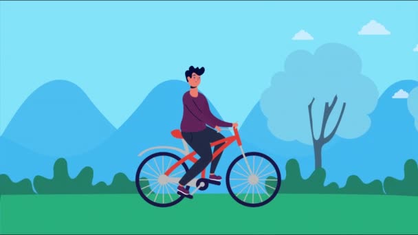 Hombre paseo en bicicleta en el parque — Vídeos de Stock
