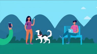 İnsanlar parkta akıllı telefon ve laptop kullanıyorlar.