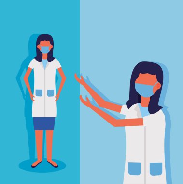 Yüz maskeli kadın doktorlar