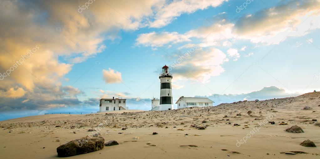 Lighthouse and Cloudy Sky