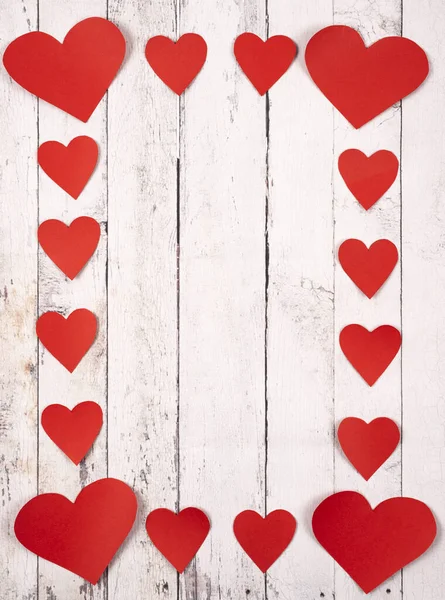 Flatlay composition with hearts on a wooden background — Stock Photo, Image