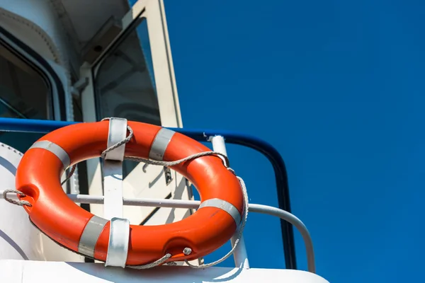 Orange lifebuoy on a white yacht — Stock Photo, Image