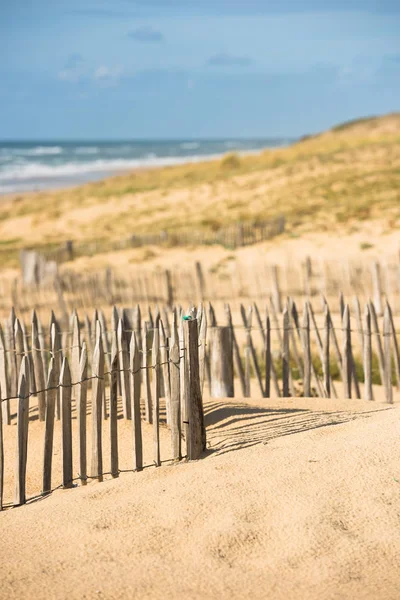 Wooden fence on Atlantic beach — Stock Photo, Image