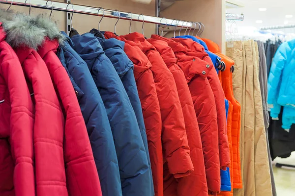 Winter clothes hanging at store — Stock Photo, Image