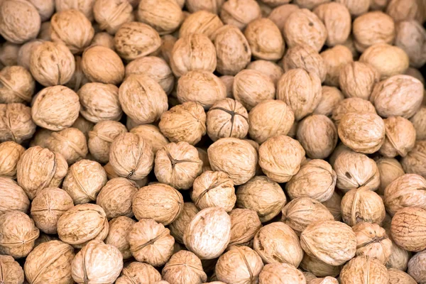 Whole walnuts background texture — Stock Photo, Image