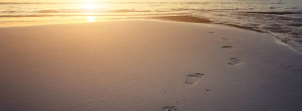 Human footprints on beach sand — Stock Photo, Image