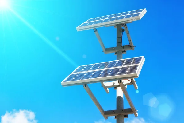 Solar panels on bright blue sky background — Stock Photo, Image