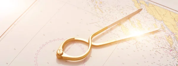 Pair of compasses for navigation on a sea map — Stock Photo, Image
