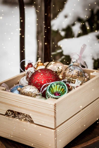 Christmas decoration balls in a wooden box — Stock Photo, Image