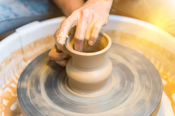 Womens hands of a potter creating an earthen jar — Stock Photo, Image