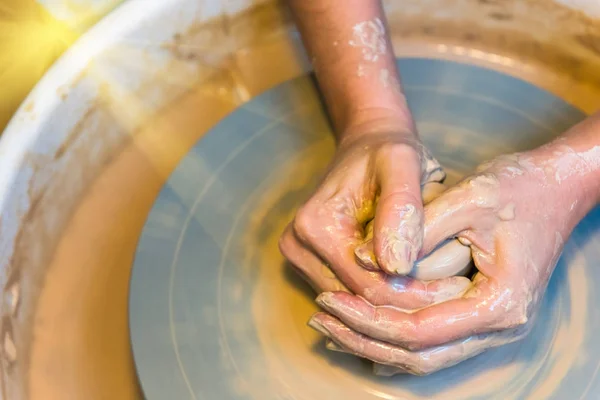 Womens hands of a potter creating an earthen jar — Stock Photo, Image