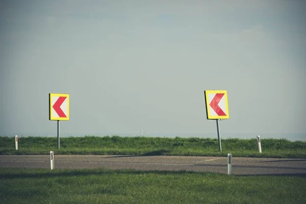 Turn left sign on a country road — Stock Photo, Image