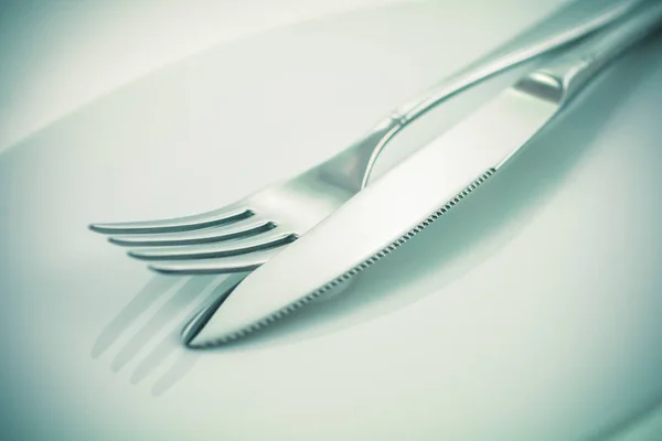 Fork and knife on a white background — Stock Photo, Image